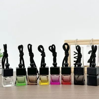 Refillable glass car fragrance bottles with decorative floral clay covers