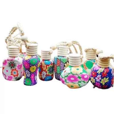 Refillable glass car air freshener bottles with floral clay covers