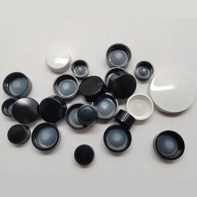 Black and white phenolic (Bakelite) caps